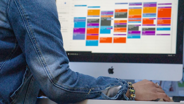 Content manager reviewing a digital dashboard with multiple projects